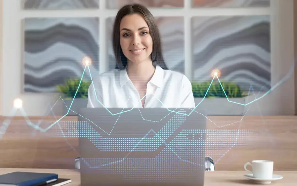 mulher sorrindo com laptop e gráficos